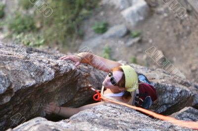 young woman climbs
