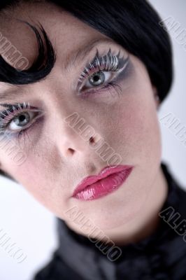 Stylish portrait of a blond girl with blue eyes