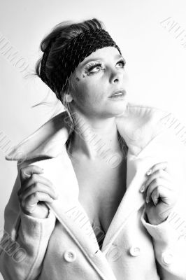 Fashion portrait of a blond girl looking up