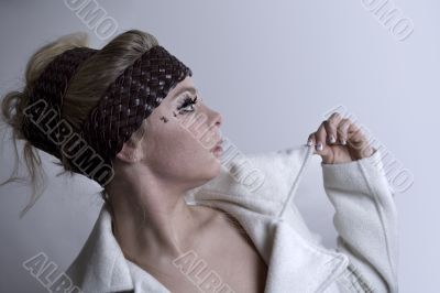 Fashion portrait of a blond girl showing