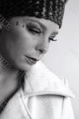 Fashion portrait of a blond girl thinking