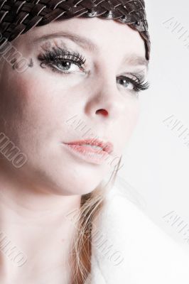 Stylish portrait of a blond girl in white