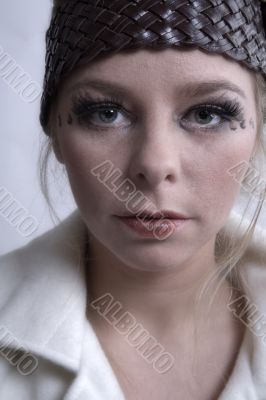 Stylish portrait of a blond girl with soft skin