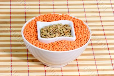 Red and yellow lentils in a white bowl