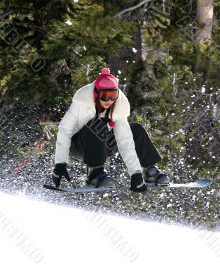 Snowboarding in a forest