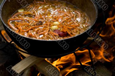 Cooking pilaf on fire