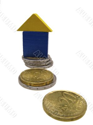 toy house on coins of euro