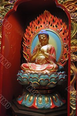 Golden statue of buddha inside a chinese temple