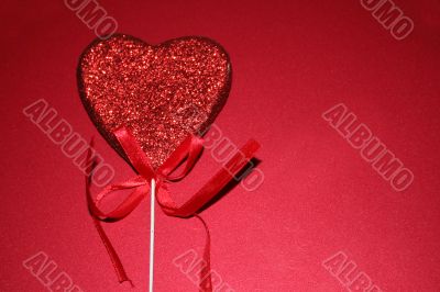 Red heart on red background