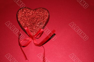 Red heart on red background