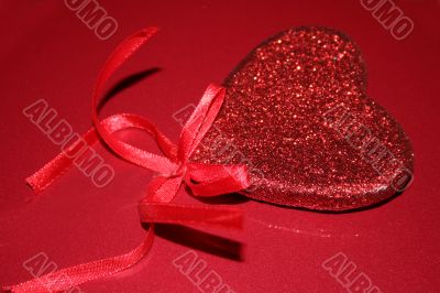 Red hearts on red background