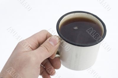 cup of tea in human hand