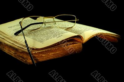 old book with a glasses
