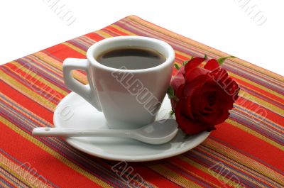 white cup of coffee with a red rose