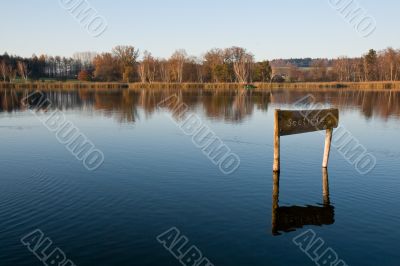 Lake in the dusk light. Autumnal colores.