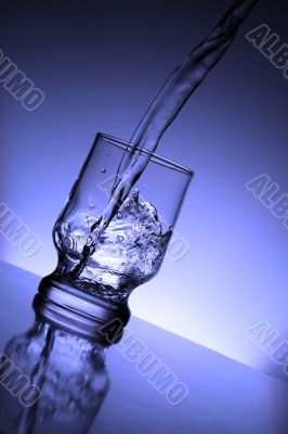 The water flowing into a glass