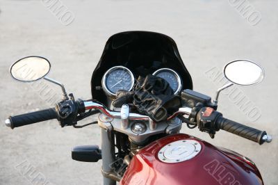 Part of a claret motorcycle.