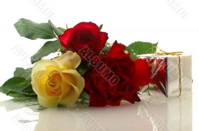 three nice roses with a gift box