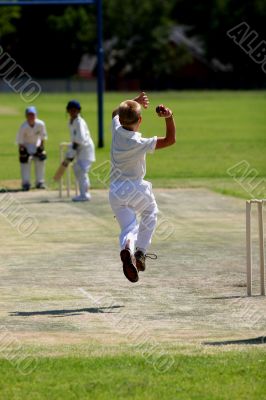 Young man bowling cricket ball