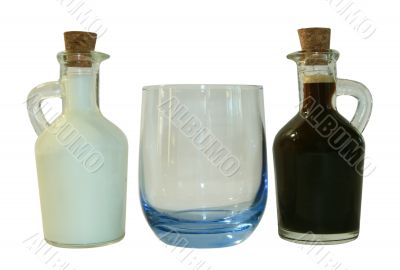 Two small decanters whith milk and coffee