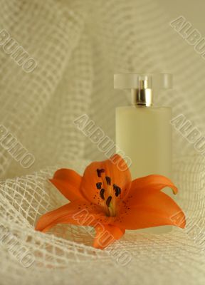 perfume with an orange lily