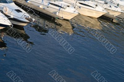 Motorboats reflections in water