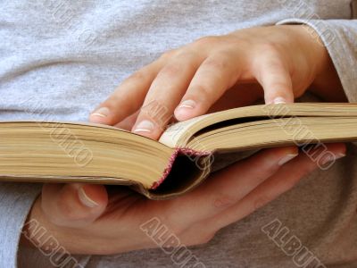 book and hands