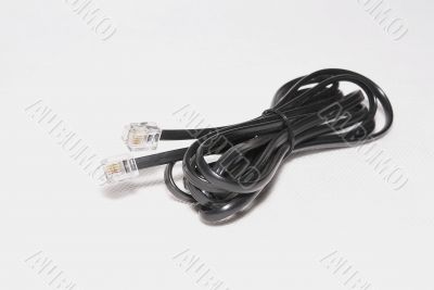 Telephone cable with RJ-11 plug.