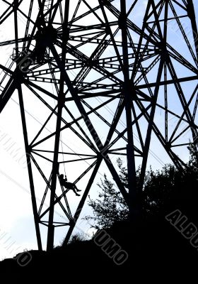 Power tower silhouette and bungee jumper
