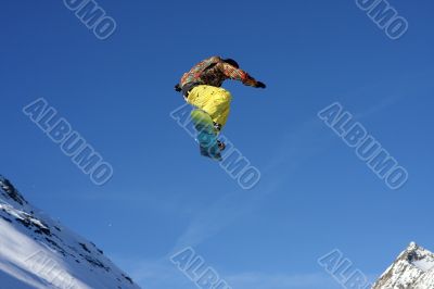Snowboarder jumping high in the air