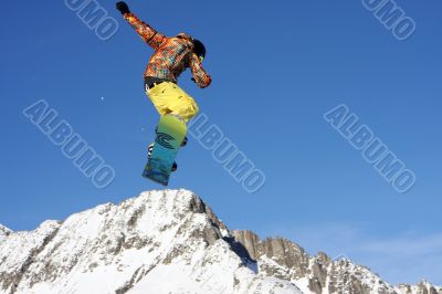 Snowboarder jumping high in the air