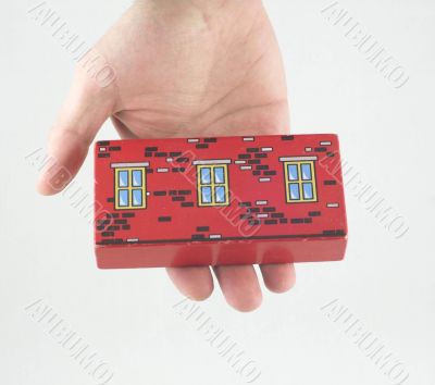 Hand with a house