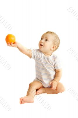 baby boy giving an orange over white