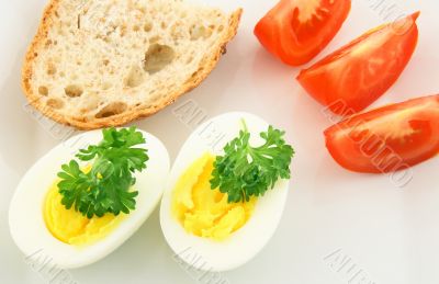 Simple meal. Eggs, bread and tomatos.