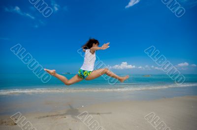 happy jump at the beach