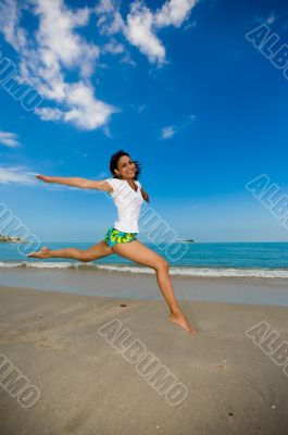 jumping joyfully at the beach