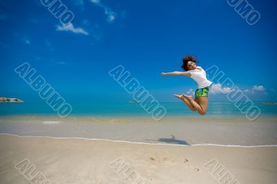 happy jump at the beach