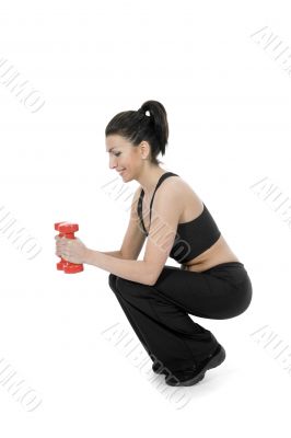 beautiful girl with dumbbells