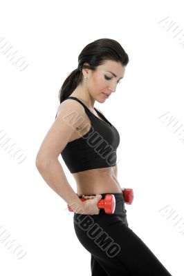 beautiful girl with dumbbells