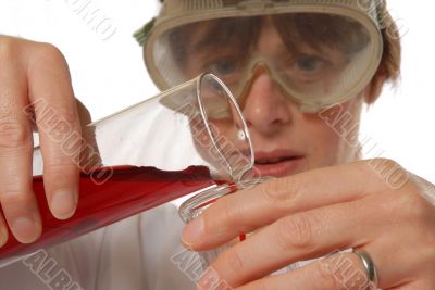 confident lady technician pouring liquid