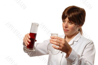 young lady scientist pours liquid