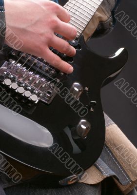 Hand on a guitar