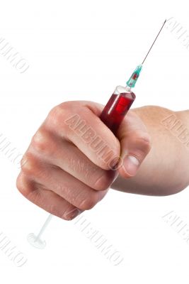 Hand with a syringe