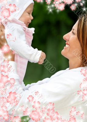 happy mother with baby and flowers