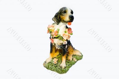 Ceramic dog with a flower collar on a white background