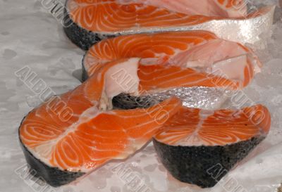 salmon fillet on fishmonger slab
