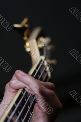 playing a bass guitar