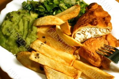 fish and  chips with peas and salad