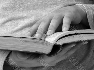 hands with book