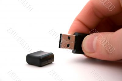 usb storage in hand on a white background.